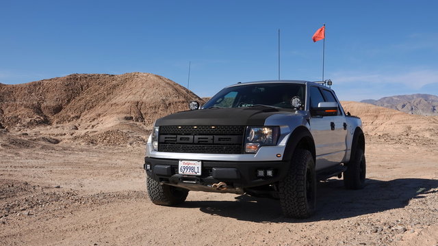 2011 Ford F-150 Raptor SVT driving off-road in a desert OHV state park. 2011 body style is the same as 2012, 2013 and 2014. Photo taken in Ocotillo Wells, CA / USA - November 26, 2019. 