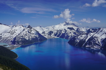 Fototapeta na wymiar snow mountains lake landscape, turquoise coloured lake in Garibaldi provincial park, BC, Canada