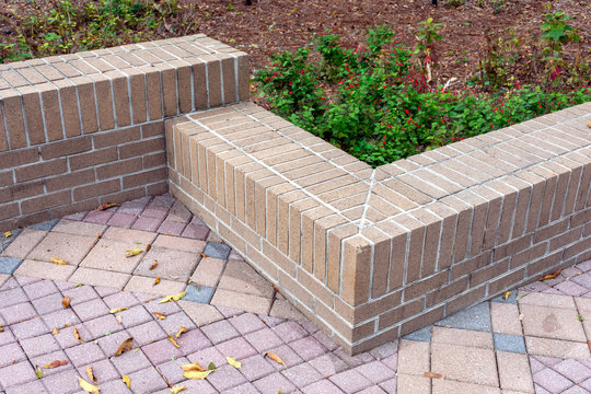 Beautiful design and materials create a retaining wall which doubles as extra seating in the garden.