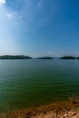 beautiful blue sky green forest mountains lake view at Kaeng Krachan National Park, Thailand.  an idea for backpacker camping relaxing hiking on long holiday weekend a couple,  family activity campfir