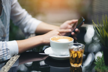 young women play smartphones.