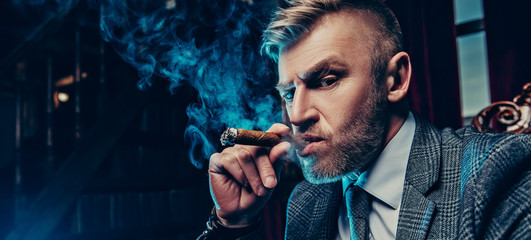 smoking a cigar in the apartment