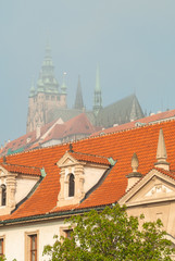Fototapeta premium Misty morning view to Prague city, Saint Vitus cathedral and Vltava river, fog. Czech Republic