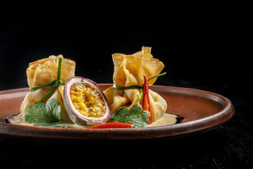 Pancakes stuffed with soyce and hot pepper. With delicious granadilla.