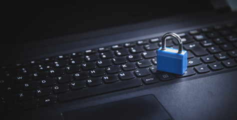 Padlock on the laptop keyboard. Internet and computer security