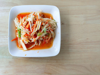 Green papaya salad is a spicy salad made from shredded unripe papaya. Originating from ethnic Lao people, it is also eaten throughout Southeast Asia.