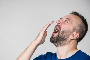 Adult man yawning