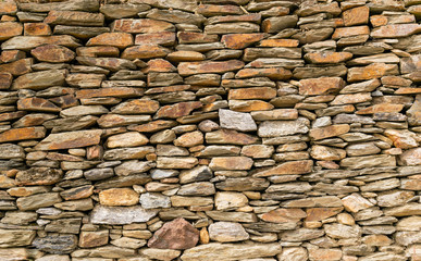 Patterns in brown tones. Stones lined up in a row. Can be used as texture in graphic designs.