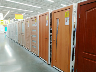 Interior doors are sold in a large building materials supermarket
