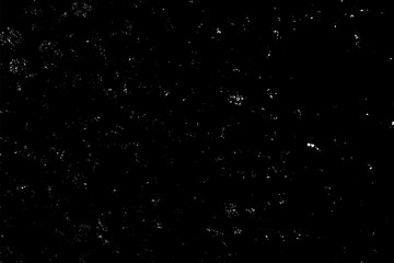 WHITE BOKEH ON A BLACK BACKGROUND. LIGHT SPOTS TEXTURE. FALLING SNOW. STAR SKY.