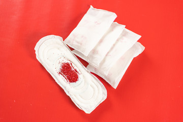 close up of woman hygiene protection on red background