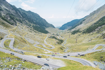 Landscape of peaceful green rocks and serpentine road