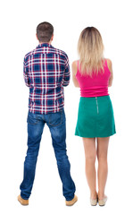 Back view of couple. beautiful friendly girl and guy together.