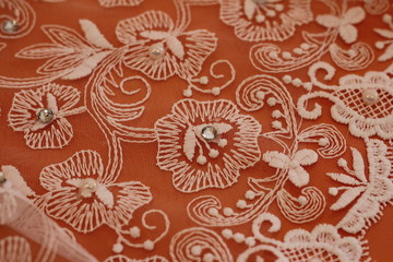 wedding dress with lace and rhinestones on orange background