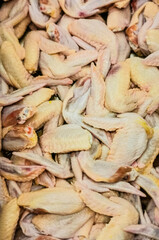Pile Raw chicken wings background 