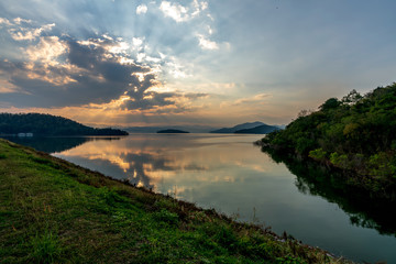 beautiful blue sky green forest mountains lake view at Kaeng Krachan National Park, Thailand.  an idea for backpacker hiking on long weekend or a couple, family holiday activity camping relaxing