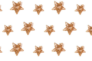 Fototapeta na wymiar Pattern made from gold stars isolated on white background. Festive concept.