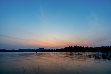 beautiful blue sky green forest mountains lake view at Kaeng Krachan National Park, Thailand.  an idea for backpacker hiking on long weekend or a couple, family holiday activity camping relaxing