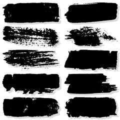 Strokes with a dry brush. Vector texture of paint spots. Set of grunge blots. The template for the background. Black ink isolated on white