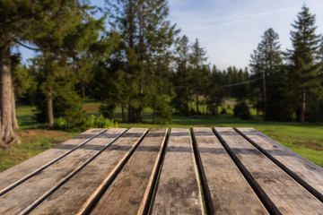 Wooden picnic table for use as background. Background for photomontage. Suitable for making manipulation work on wooden floor.