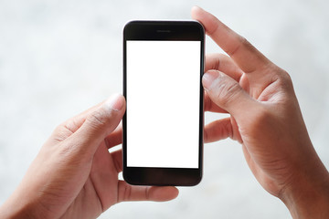 Mockup smartphone of man’s holding black mobile phone with white screen in his office.
