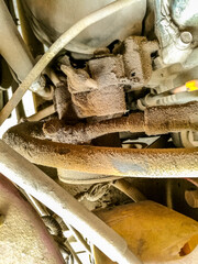 dusty and rusty mechanical parts of a modern vehicle 