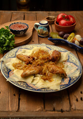 leaves khingal with fried onion and chicken