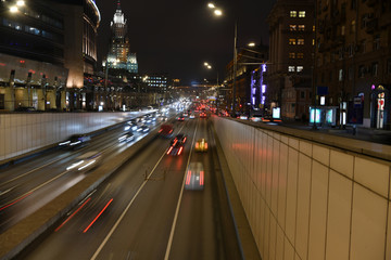 Naklejka na ściany i meble evening busy traffic on highways in a metropolis