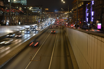 Fototapeta na wymiar evening busy traffic on highways in a metropolis