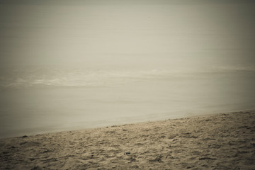 The beach and the sea are dark.