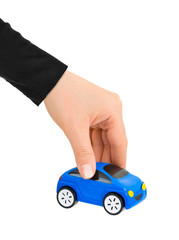 Hand and toy car