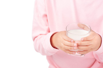 Thai kid holding glass of milk, young Asian girl drinking milk for strong health on white background