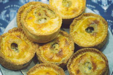 Quiche pies. Mini quiche pies stuffed with meat and vegetables