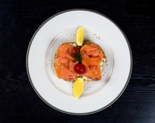smoked salmon slices with side lemons