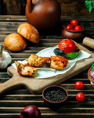 grilled chicken with vegetables on desk