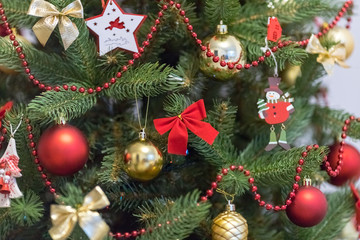 Christmas decoration and celebration. Christmas tree.  Xmas red and gold balls. New Year preparations. New Year concept. Christmas tree toys.