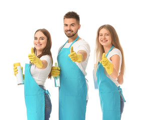Team of janitors showing thumb-up gesture on white background