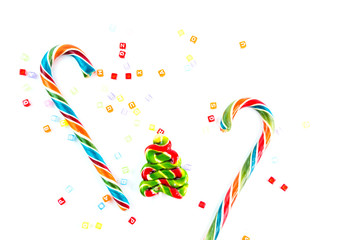 Colorful festive Lollipops and candy in fir form on white background selective focus