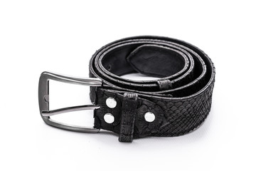 Fashion luxury snakeskin python black belt isolated on a white background.