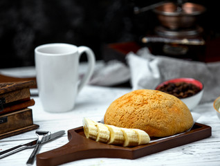 white bread on desk with side sliced banana