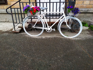 Fototapeta na wymiar .A vintage two-wheeled Bicycle with flowers on it.