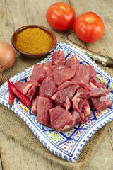 raw lamb meat on a wooden table