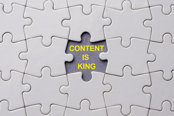 Content is king written on blank space of last puzzle piece place