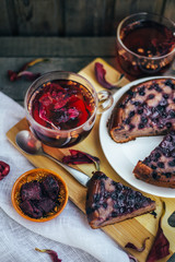 Red tea for two - two cups. Sliced ​​blueberry homemade pie.