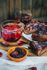 Red tea for two - two cups. Sliced ​​blueberry homemade pie.