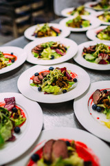Cooking a delicious main course in the restaurant kitchen. Catering on holiday.