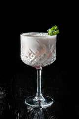 Cocktail Pina Collada. Garnished with a leaf of mint.