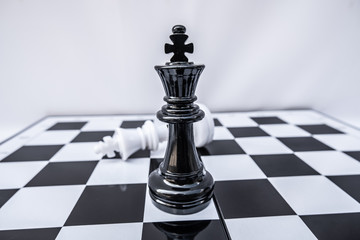 The chess board shows leadership, followers and business success strategies