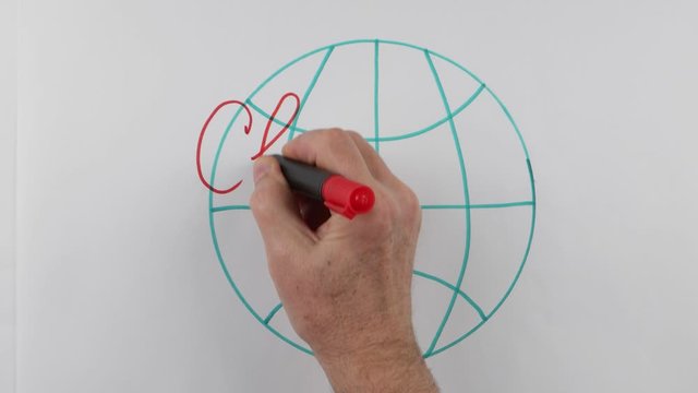 The lecturer writes on a whiteboard the term "climate crisis" at a lecture on the climate change. Using of a visual aids