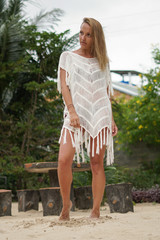 Naklejka premium The girl in a white dress in the garden. 